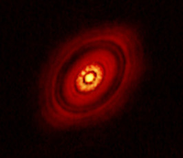 Searching for planets around young stars with aperture masking interferometry