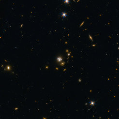 <p>HE0435-1223, located in the centre of this wide-field image, is among the five best lensed quasars discovered to date. The foreground galaxy creates four almost evenly distributed images of the distant quasar around it.</p>