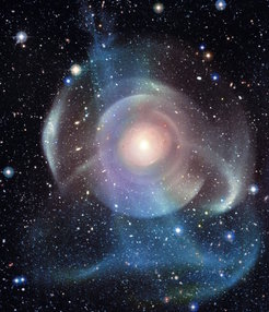 Figure 1: The observed stellar halo of NGC 474 showing the complex substructure present in the outer regions of this large elliptical galaxy. Shells and tidal stellar streams are formed as a consequence of the interactions with and accretion of smaller galaxies.