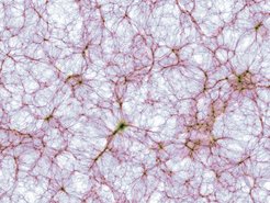 Dünner Schnitt durch die kosmische Großraumstruktur in der größten Simulation des Illustris-TNG Projekts. Die Bildhelligkeit zeigt die Massendichte und der Farbton die mittlere Gastemperatur der herkömmlichen („baryonischen“) Materie. Die dargestellte Region erstreckt sich von links nach rechts über 1.2 Milliarden Lichtjahre. Die zugrunde liegende Rechnung ist die gegenwärtig größte magneto-hydrodynamische Simulation der Galaxienentstehung und verfolgt die Entwicklung von mehr als 30 Milliarden Volumenelementen und Materieteilchen.