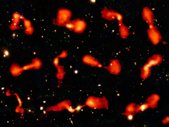 A montage of low-power radio galaxies from the HETDEX region of the LoTSS survey, shown on an optical background.